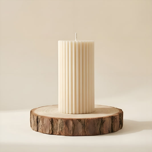 Luxury ivory ribbed pillar candle on rustic wooden base, minimalist home decor